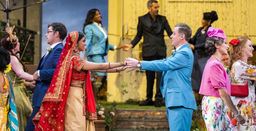 Ashnaa Sasikaran as Eurydice and Nicholas Watts as Orpheus with members of the Orpheus company